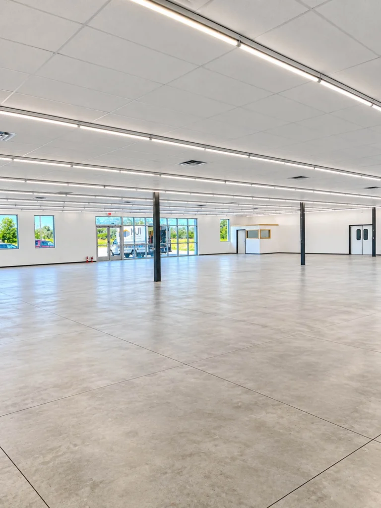 Interior of the new Dollar Tree in Howard featuring a bright, open retail space with durable flooring, overhead lighting, large windows, and a finished office area.