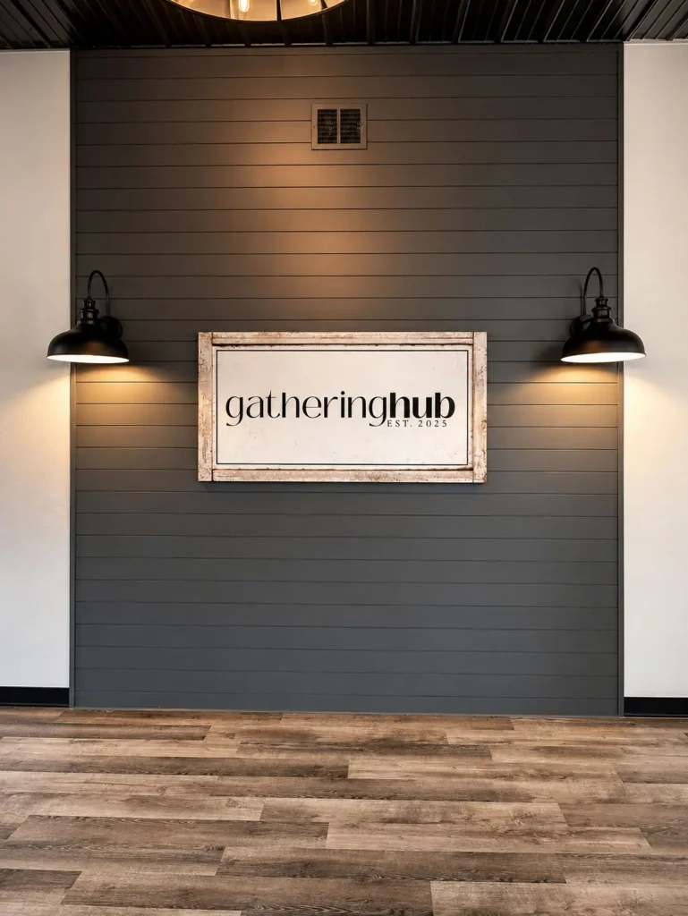 Gathering Hub branded feature wall with decorative lighting, modern finishes, and welcoming design elements that create a stylish backdrop for events and community gatherings.