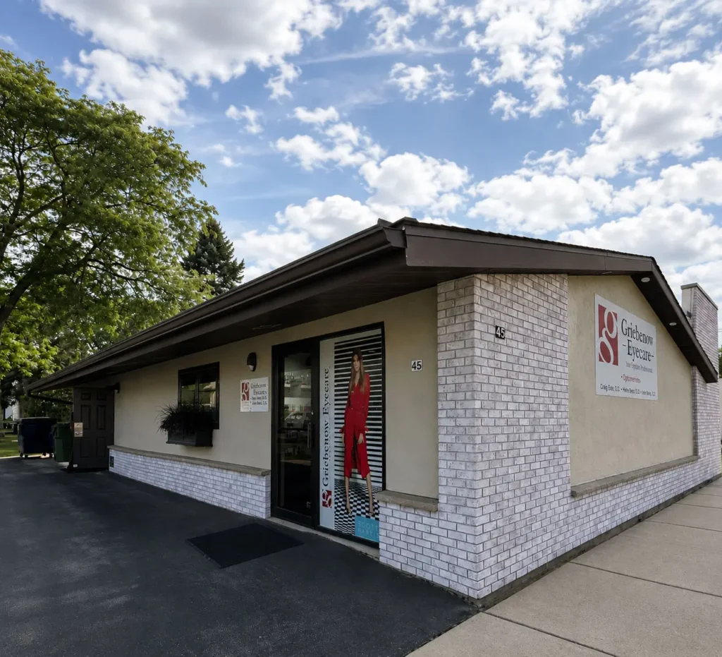 Exterior view of Griebenow Eye Care in Clintonville featuring updated building finishes, modern storefront windows, prominent clinic signage, and improved patient access.