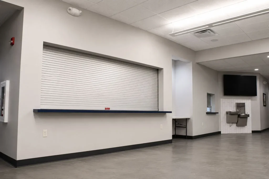 Serving area at St. Peter's Lutheran School featuring a renovated cafeteria service window, modern finishes, and improved functionality for student meal distribution.