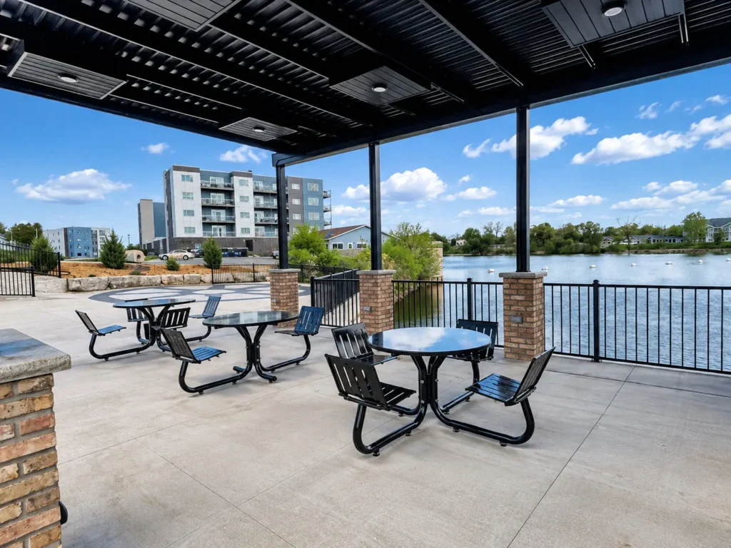 Covered riverside pavilion at Cedar Overlook in Kimberly with outdoor seating, panoramic Fox River views, and a welcoming community space designed for residents and visitors to gather and enjoy the waterfront.